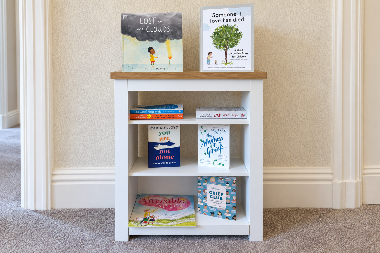 A shelf of grief-support books for adults and children